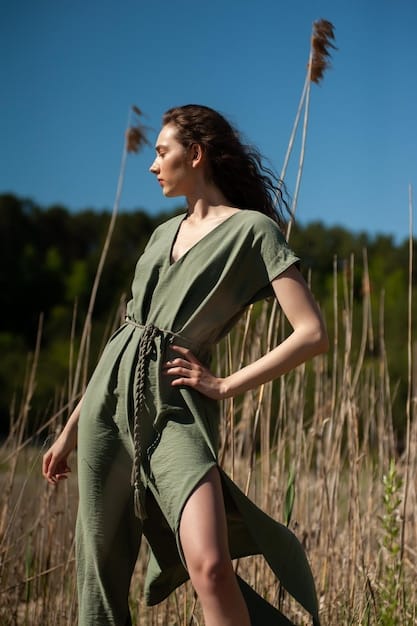 A fashion runway showing models in flowing garments featuring muted greens, earthy browns, and soft off-whites, emphasizing sustainable fabrics and a natural, calm aesthetic for 2025.