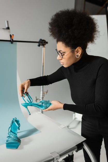 A cutting-edge footwear studio interior, depicting a designer working on a sneaker prototype using advanced 3D printing technology, surrounded by ergonomic tools and futuristic material samples. The scene emphasizes innovation, precision, and sustainability in the creation process.
