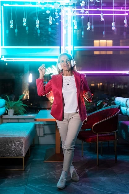 A person wearing sleek, futuristic AR glasses watching a virtual concert unfold in their living room, with holographic performers on their coffee table and dynamic lighting synchronized to the music.